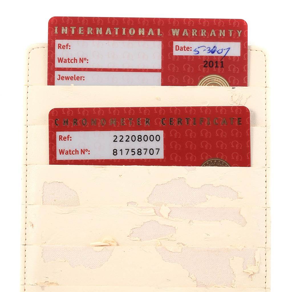 This image shows the International Warranty and Chronometer Certificate cards for the Omega Seamaster 2220.80.00 Men
s Stainless Steel Blue Dial 2220.80.00 Men
s Stainless Steel Blue Dial model.