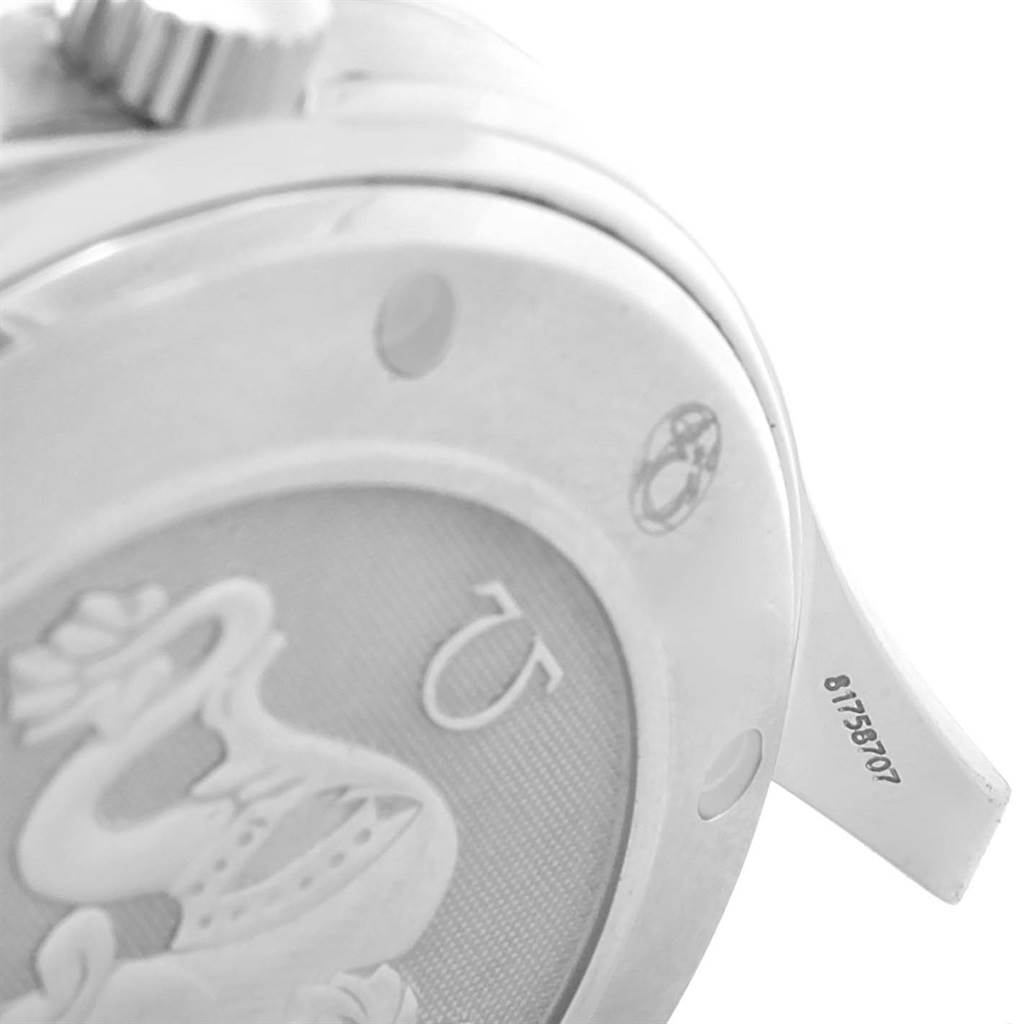 The image shows a close-up of the back case and crown of an Omega Seamaster 2220.80.00 Men
s Stainless Steel Blue Dial 2220.80.00 Men
s Stainless Steel Blue Dial watch, highlighting engravings and serial numbers.