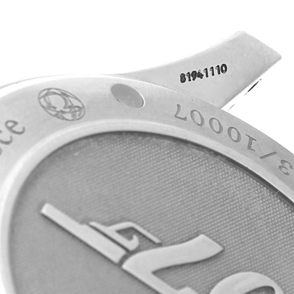 This image shows a close-up of the back casing and serial number of an Omega Seamaster 212.30.41.20.01.001 Men's Stainless Steel Black Dial 212.30.41.20.01.001 Men's Stainless Steel Black Dial watch, with parts of the engraving visible.