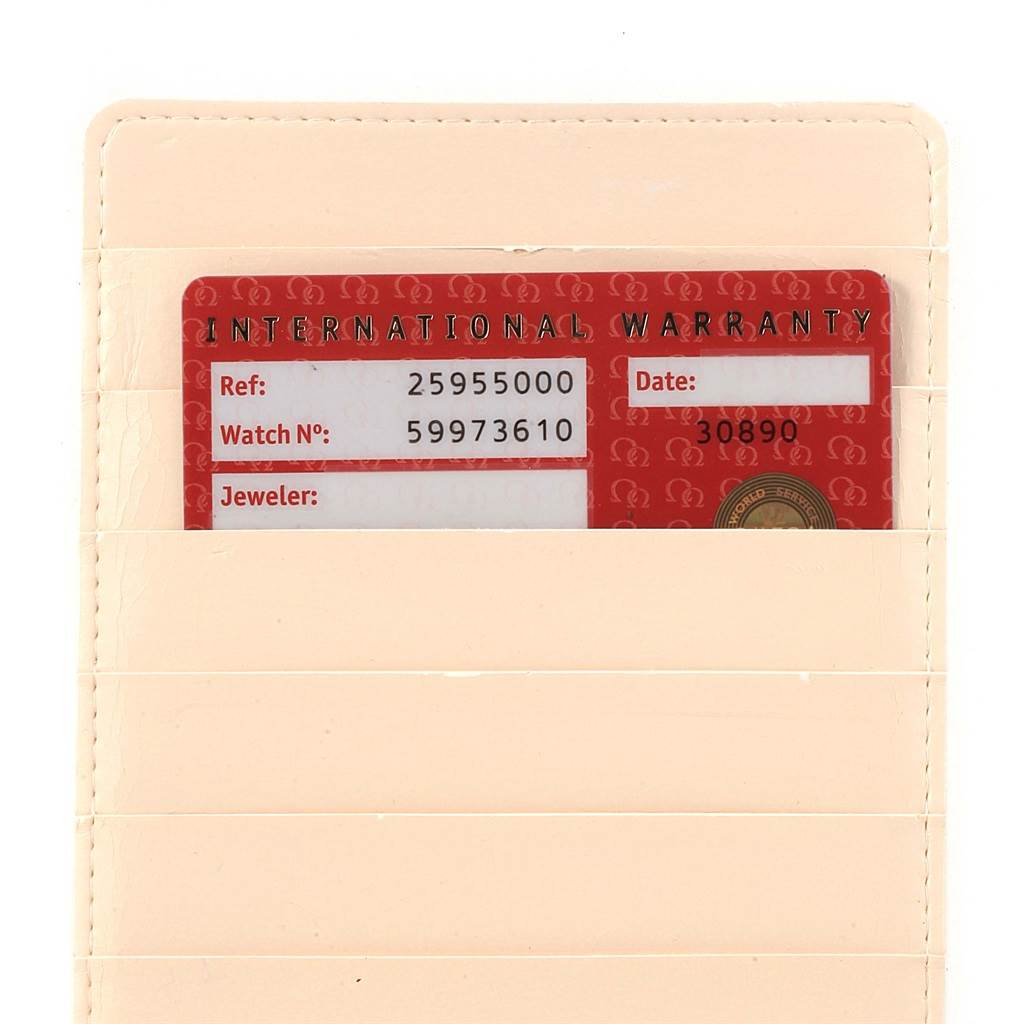 The image shows the International Warranty card for an Omega Seamaster 2595.50.00 Men
s Stainless Steel Black Dial 2595.50.00 Men
s Stainless Steel Black Dial watch, inserted into a cream-colored cardholder.