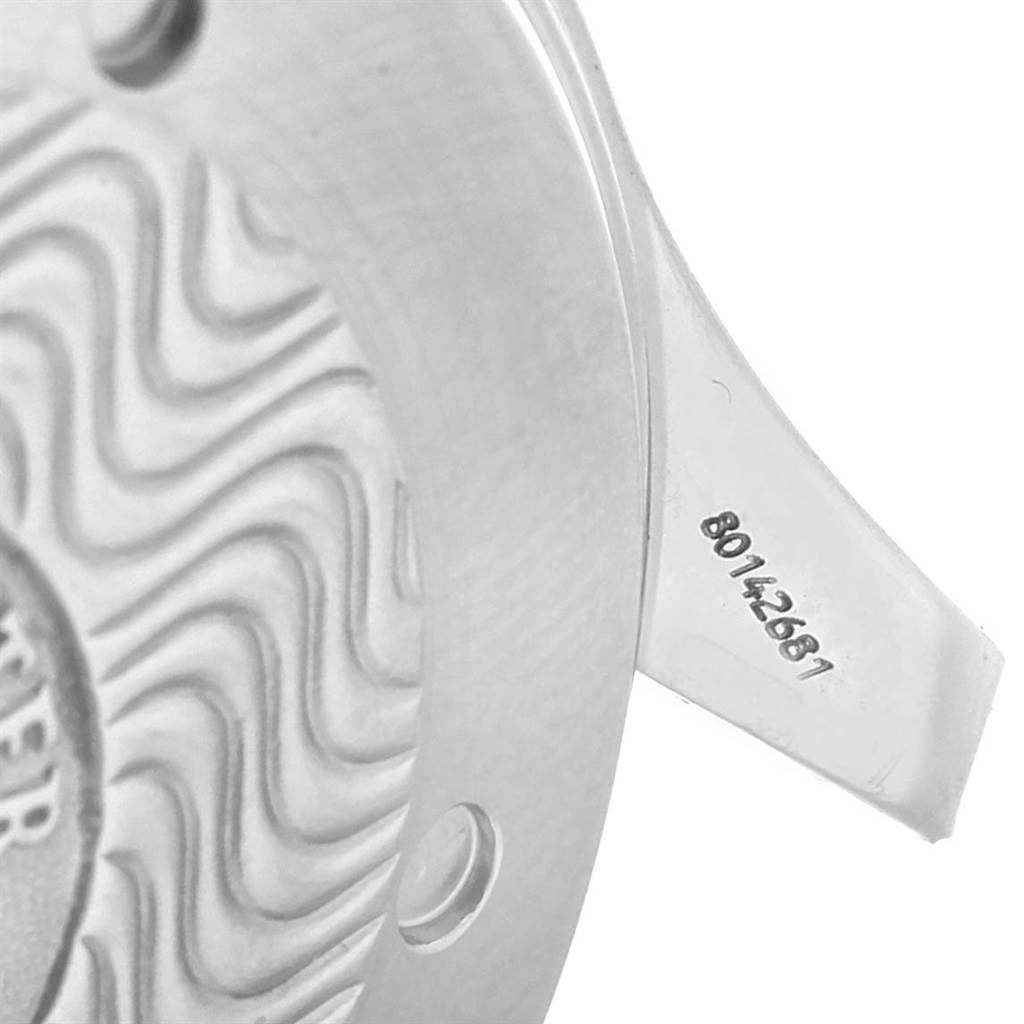 The image shows a close-up of the back of an Omega Seamaster 2531.80.00 Men
s Stainless Steel Blue Dial 2531.80.00 Men
s Stainless Steel Blue Dial watch, highlighting the case back with engraving and a serial number on the lug.