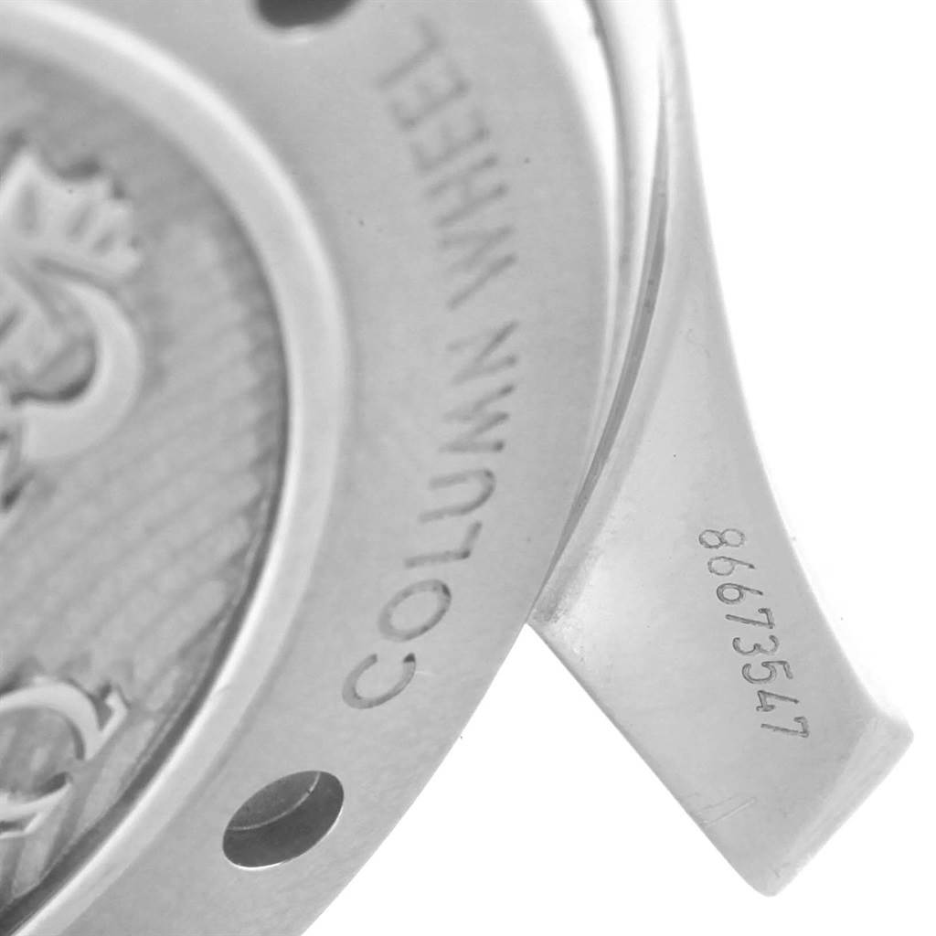 This image shows a close-up of the back side of an Omega Seamaster 212.30.44.50.01.001 Men
s Stainless Steel Black Dial 212.30.44.50.01.001 Men
s Stainless Steel Black Dial watch, highlighting the column wheel mechanism and part of the serial number.