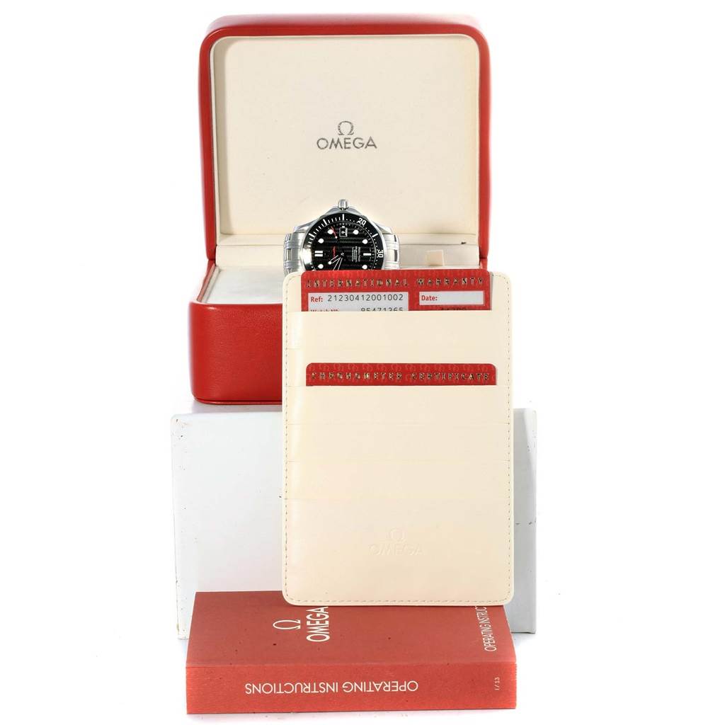The image shows an Omega Seamaster 212.30.41.20.01.002 Men
s Stainless Steel Black Dial 212.30.41.20.01.002 Men
s Stainless Steel Black Dial watch in its box, with warranty cards and an operating instructions booklet.