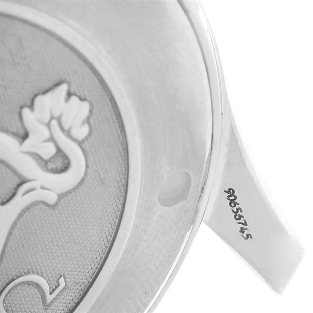 The image shows a close-up of the back cover of an Omega Seamaster 2221.80.00 Men
s Stainless Steel Blue Dial 2221.80.00 Men
s Stainless Steel Blue Dial watch, featuring engraved details and part of the serial number.