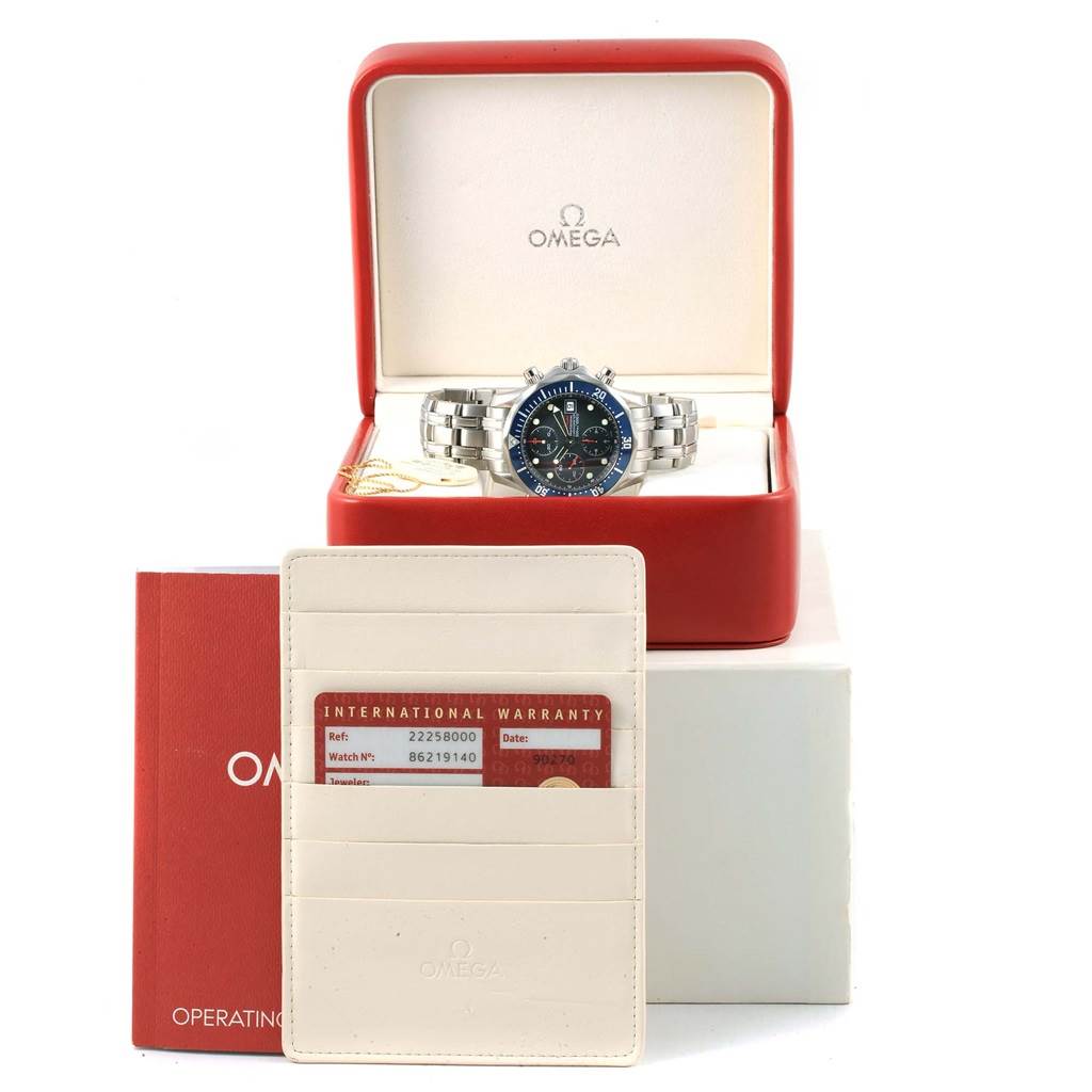 The Omega Seamaster 2225.80.00 Men
s Stainless Steel Blue Dial 2225.80.00 Men
s Stainless Steel Blue Dial watch is shown front-facing in its box, accompanied by the warranty card and an instruction manual.