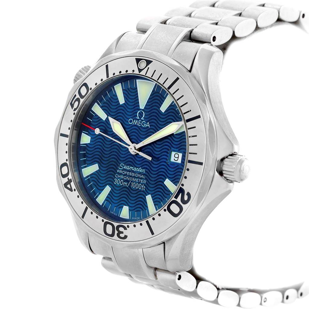 The image shows a side-angle view of an Omega Seamaster 2255.80.00 Men
s Stainless Steel Blue Dial 2255.80.00 Men
s Stainless Steel Blue Dial watch, highlighting its blue dial, bezel, crown, and stainless steel bracelet.