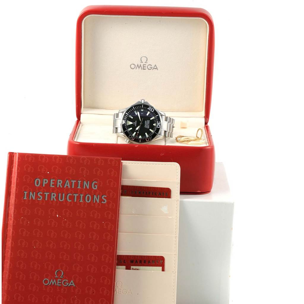 The image shows an Omega Seamaster 2254.50.00 Men
s Stainless Steel Black Dial 2254.50.00 Men
s Stainless Steel Black Dial watch in its box with operating instructions and warranty cards.