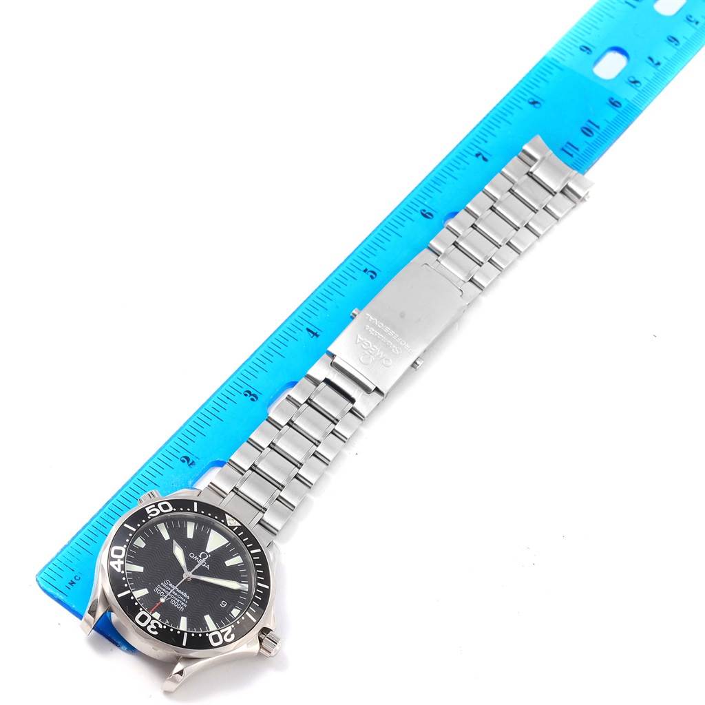 The Omega Seamaster 2254.50.00 Men
s Stainless Steel Black Dial 2254.50.00 Men
s Stainless Steel Black Dial watch is shown from a top-down angle, alongside a ruler for size reference.