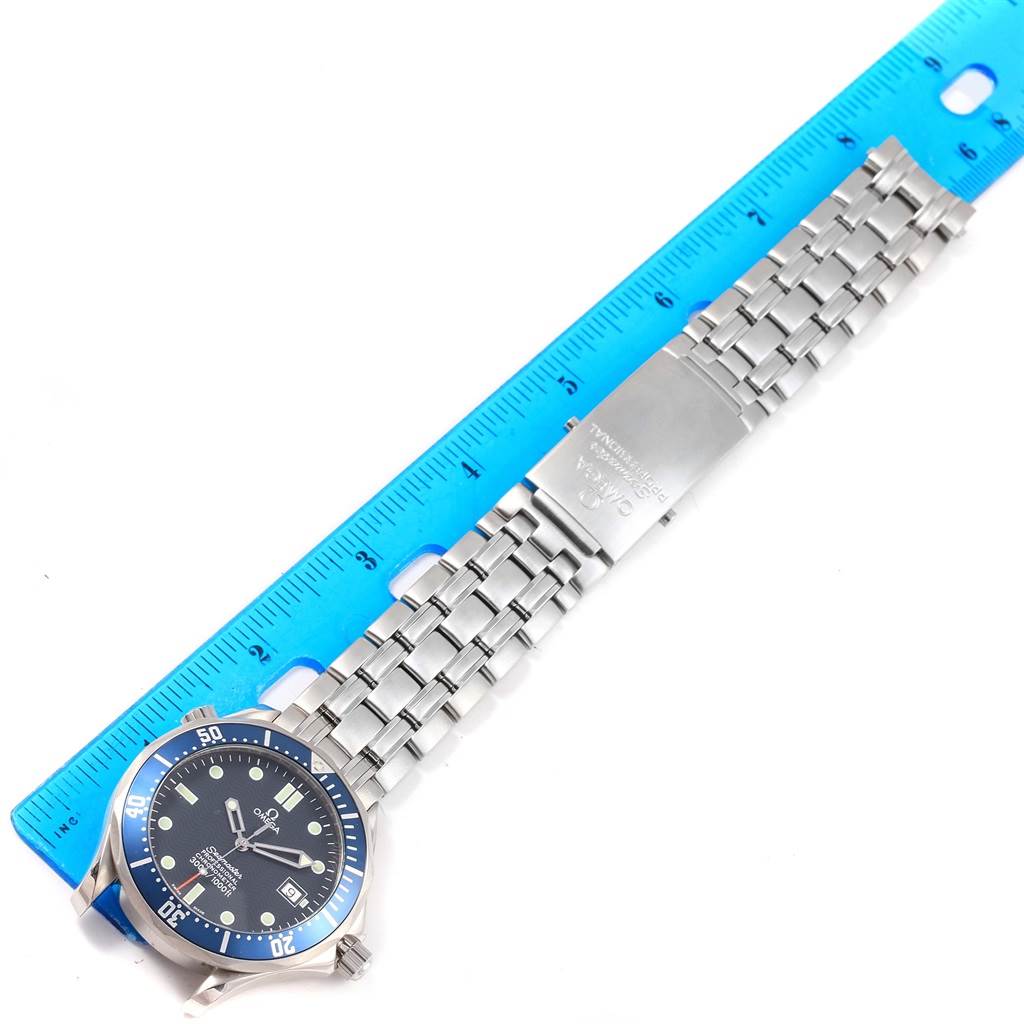 The image shows an Omega Seamaster 2531.80.00 Men
s Stainless Steel Blue Dial 2531.80.00 Men
s Stainless Steel Blue Dial wristwatch lying flat with its bracelet extended and a ruler for scale.