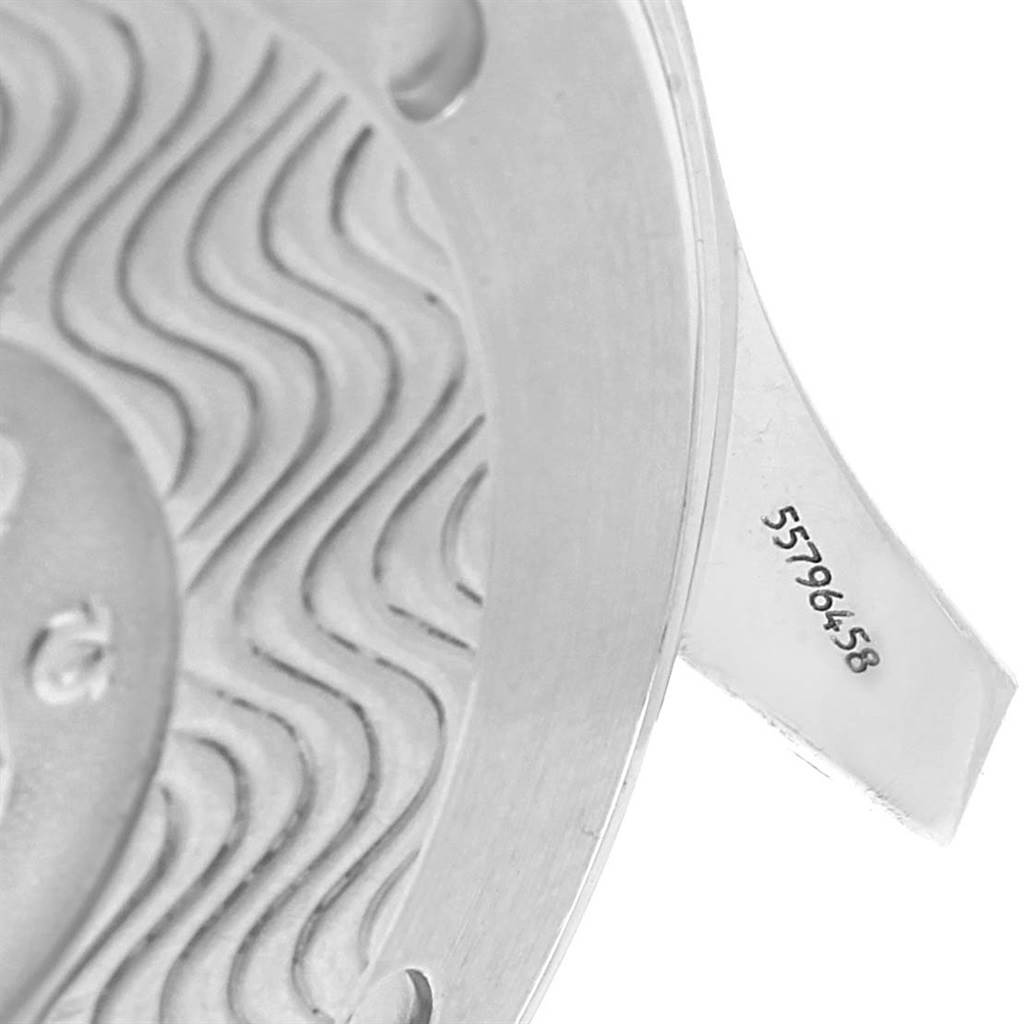 The image shows a close-up of the back case of an Omega Seamaster 2541.80.00 Men
s Stainless Steel Blue Dial 2541.80.00 Men
s Stainless Steel Blue Dial watch, highlighting the serial number and wave pattern detail.