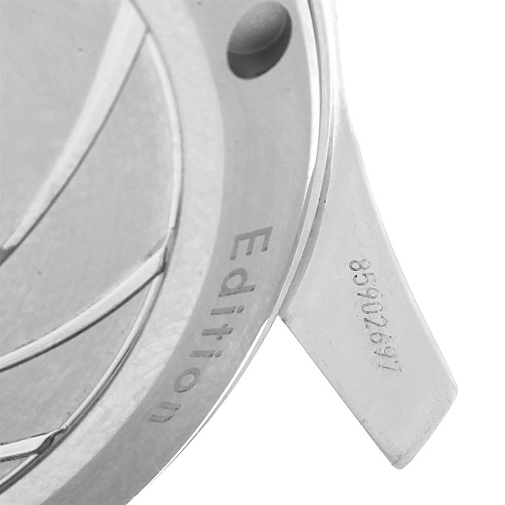 This image shows a close-up of the case back and a serial number of an Omega Seamaster 212.30.36.20.51.001 Men's Stainless Steel Black Dial 212.30.36.20.51.001 Men's Stainless Steel Black Dial watch.