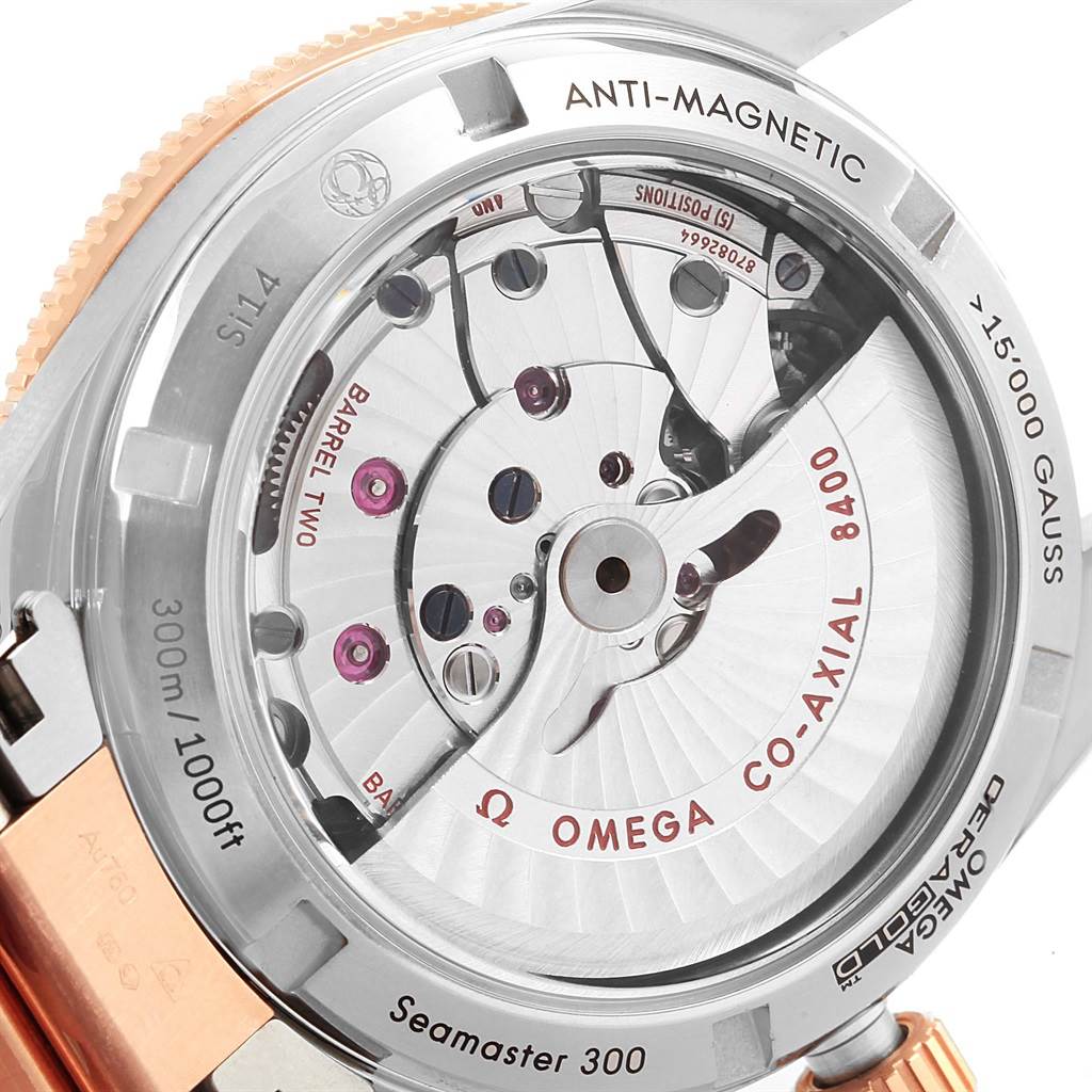 The image shows the back view of the Omega Seamaster 233.20.41.21.01.001 Men's Steel and Gold (two tone) Black Dial 233.20.41.21.01.001 Men's Steel and Gold (two tone) Black Dial 300, highlighting its anti-magnetic and co-axial 8400 movement.