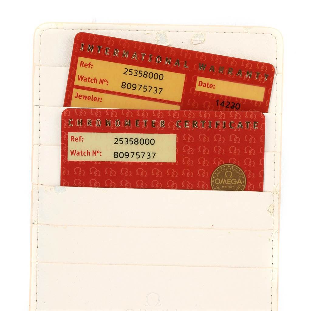 The image shows the International Warranty and Chronometer Certificate cards for an Omega Seamaster 2535.80.00 Men
s Stainless Steel Blue Dial 2535.80.00 Men
s Stainless Steel Blue Dial watch.