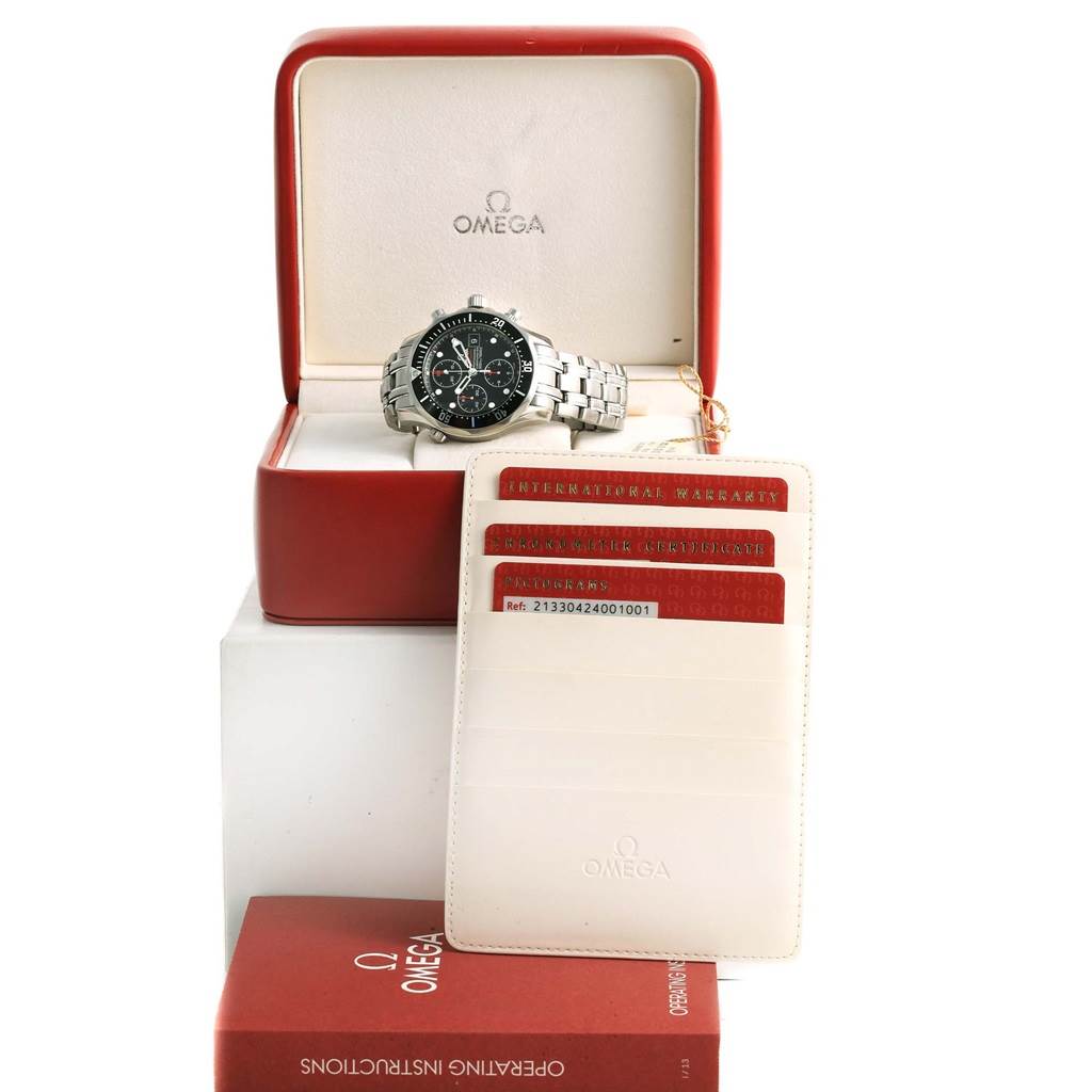 The Omega Seamaster 213.30.42.40.01.001 Men
s Stainless Steel Black Dial 213.30.42.40.01.001 Men
s Stainless Steel Black Dial watch is displayed in its open box, accompanied by warranty cards and an operating instruction booklet.