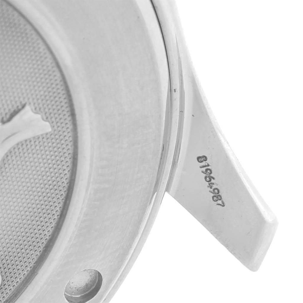 The image shows a close-up of the case back edge and lug of an Omega Seamaster 2220.80.00 Men
s Stainless Steel Blue Dial 2220.80.00 Men
s Stainless Steel Blue Dial watch, including part of its serial number.