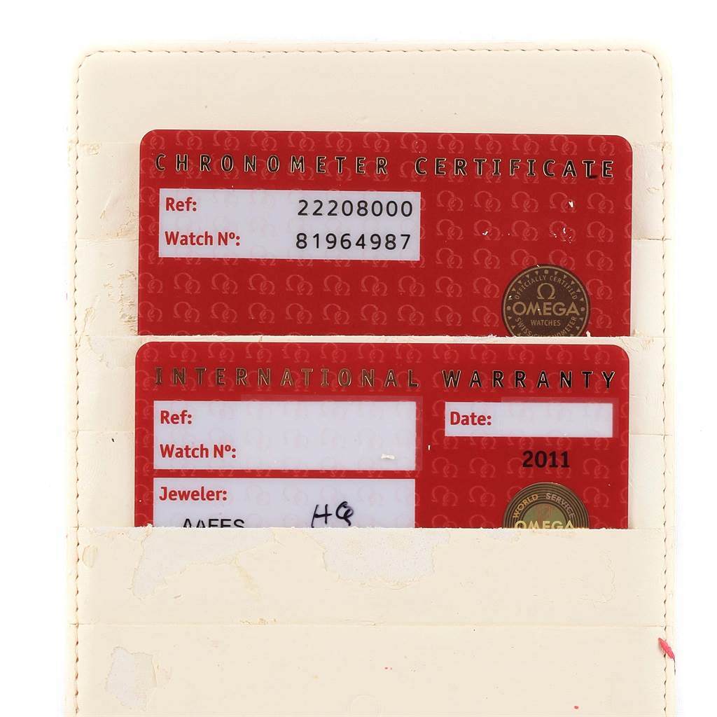 The image shows the Chronometer Certificate and International Warranty cards for an Omega Seamaster 2220.80.00 Men
s Stainless Steel Blue Dial 2220.80.00 Men
s Stainless Steel Blue Dial watch.