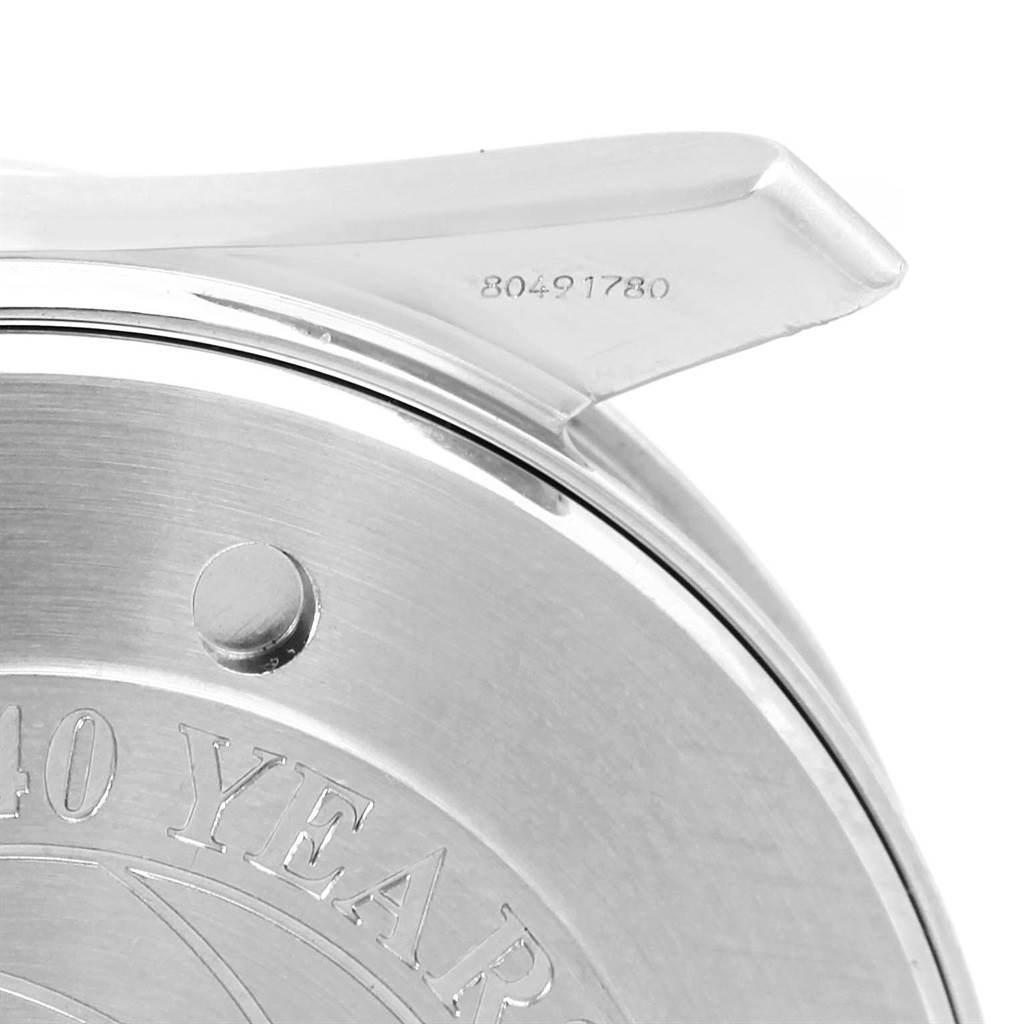 This image shows the back case of an Omega Seamaster 2537.80.00 Men's Stainless Steel Blue Dial 2537.80.00 Men's Stainless Steel Blue Dial watch at an angle, featuring part of the engraved text and serial number.