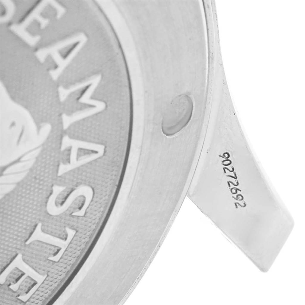 The image shows a close-up of the side and back of an Omega Seamaster 2221.80.00 Men
s Stainless Steel Blue Dial 2221.80.00 Men
s Stainless Steel Blue Dial watch case, highlighting the engraving and serial number.