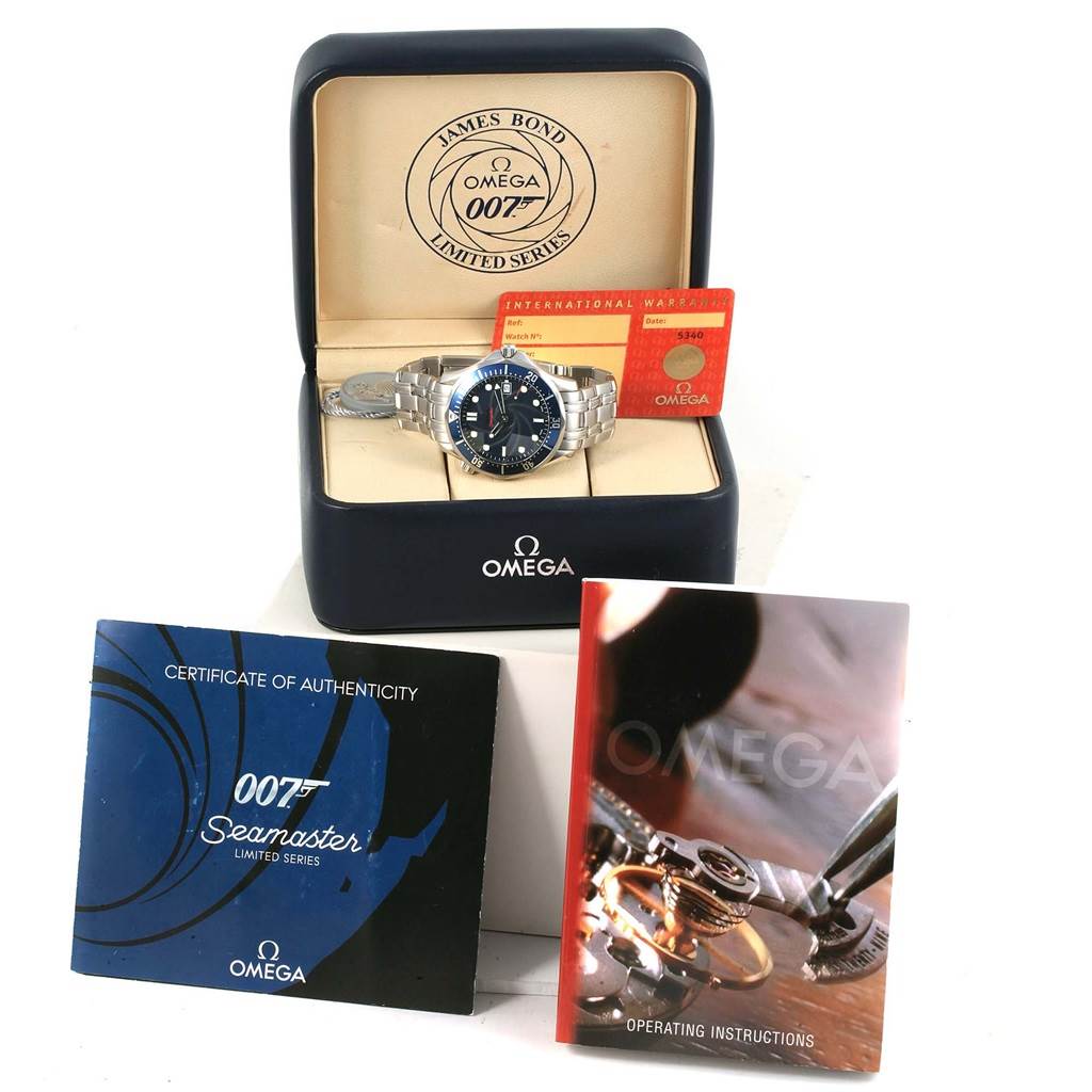 The image shows an Omega Seamaster 2226.80.00 Men's Stainless Steel Blue Dial 2226.80.00 Men's Stainless Steel Blue Dial watch at an angle placed in a box with associated accessories including certificates and manuals.