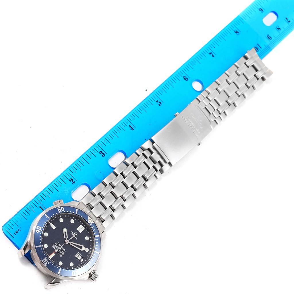 The image shows the face and bracelet of an Omega Seamaster 2531.80.00 Men
s Stainless Steel Blue Dial 2531.80.00 Men
s Stainless Steel Blue Dial watch, measured alongside a blue ruler.