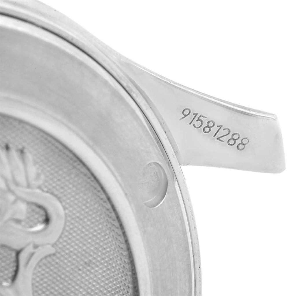 This image shows a close-up of the back case and part of the lug of the Omega Seamaster 212.30.36.61.01.001 Men
s Stainless Steel Black Dial 212.30.36.61.01.001 Men
s Stainless Steel Black Dial watch, including the serial number.