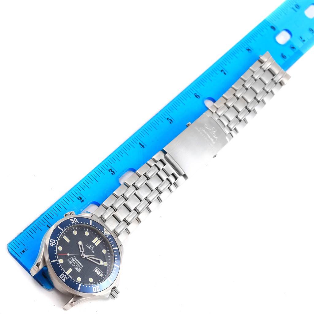 The image shows an Omega Seamaster 2531.80.00 Men's Stainless Steel Blue Dial 2531.80.00 Men's Stainless Steel Blue Dial watch laying flat with a ruler beside it for scale.