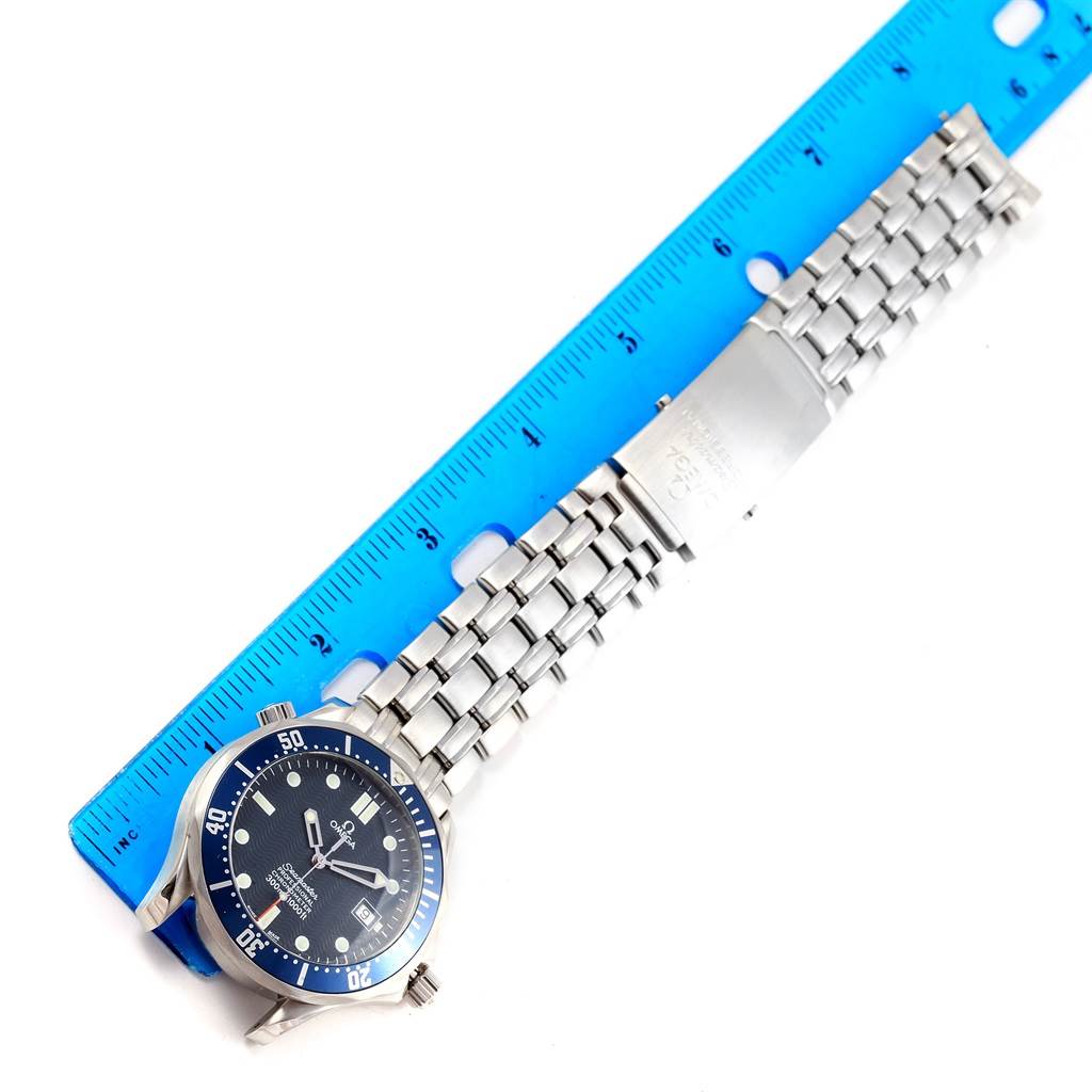 The image shows an Omega Seamaster 2531.80.00 Men
s Stainless Steel Blue Dial 2531.80.00 Men
s Stainless Steel Blue Dial watch laid flat with its face and stainless steel bracelet visible, alongside a blue ruler for scale.