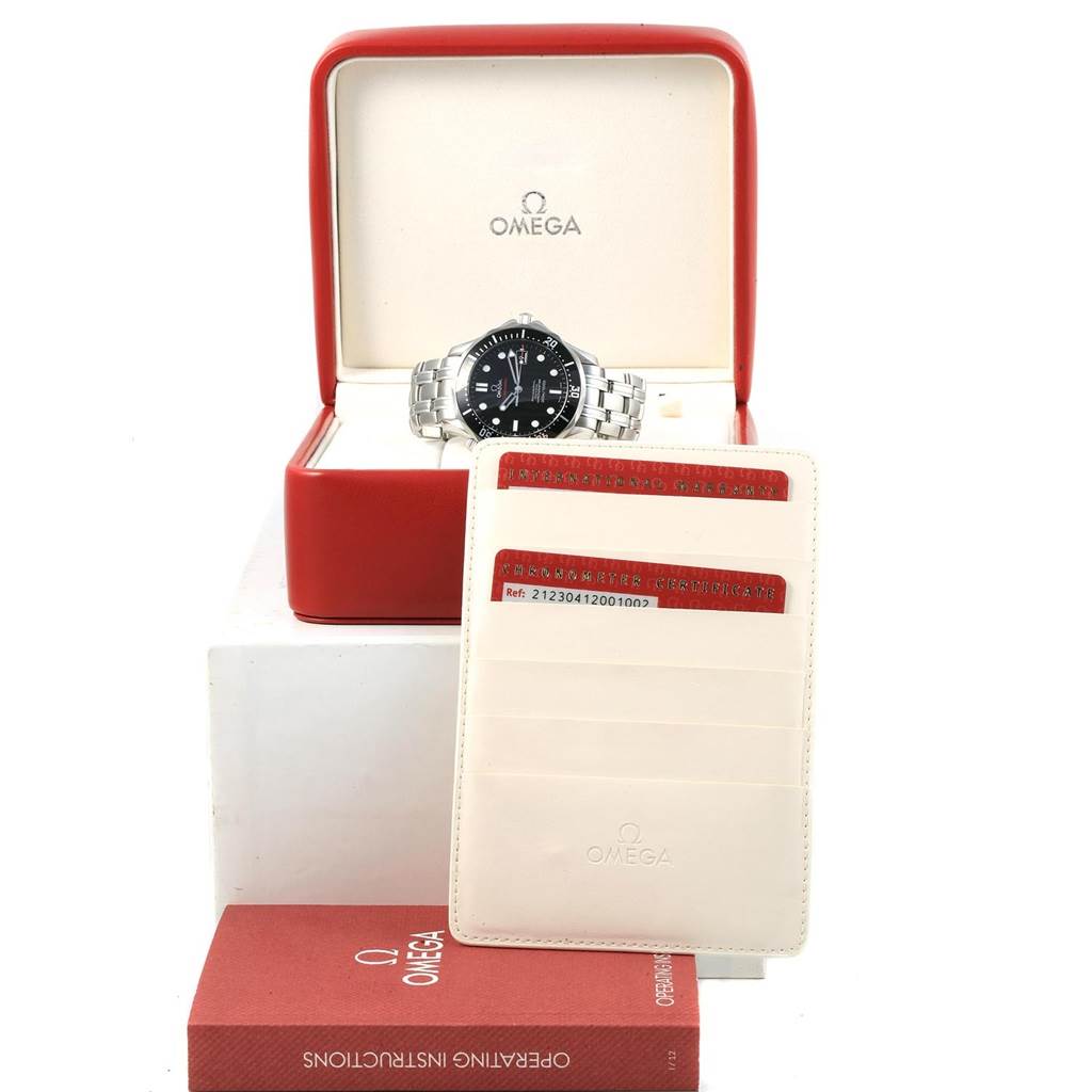 The image shows an Omega Seamaster 212.30.41.20.01.002 Men
s Stainless Steel Black Dial 212.30.41.20.01.002 Men
s Stainless Steel Black Dial watch positioned in its open red case, along with warranty cards and an instruction manual.