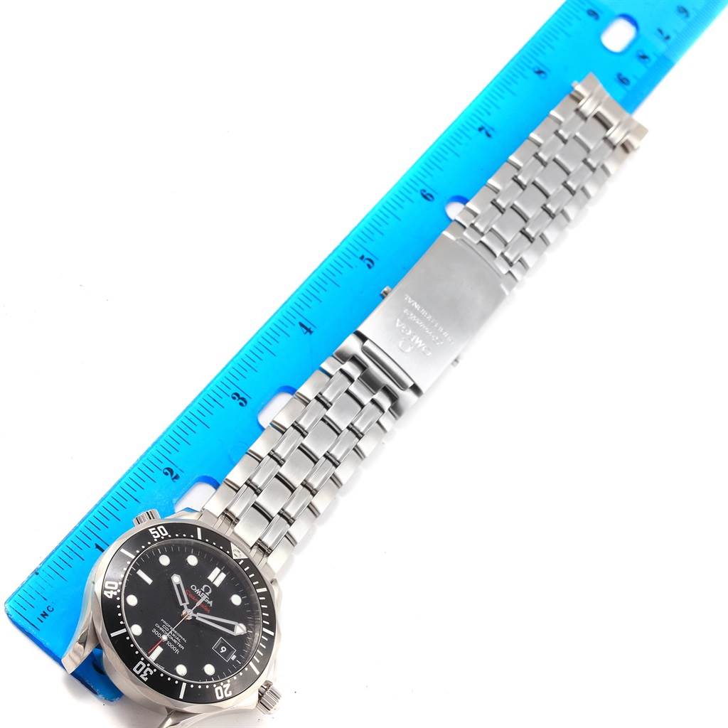 The image displays an Omega Seamaster 212.30.41.20.01.002 Men
s Stainless Steel Black Dial 212.30.41.20.01.002 Men
s Stainless Steel Black Dial watch laid flat next to a blue ruler, highlighting the face and metal bracelet.