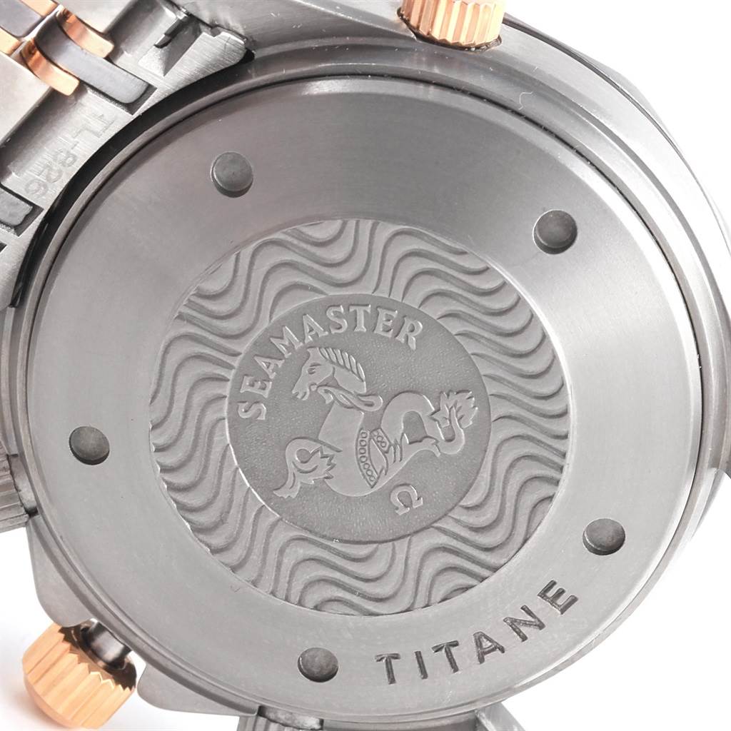 The image shows the back case and part of the strap of an Omega Seamaster 2296.80.00 Men
s Titanium Blue Dial 2296.80.00 Men
s Titanium Blue Dial watch, featuring the Seamaster logo and "TITANE" engraving.