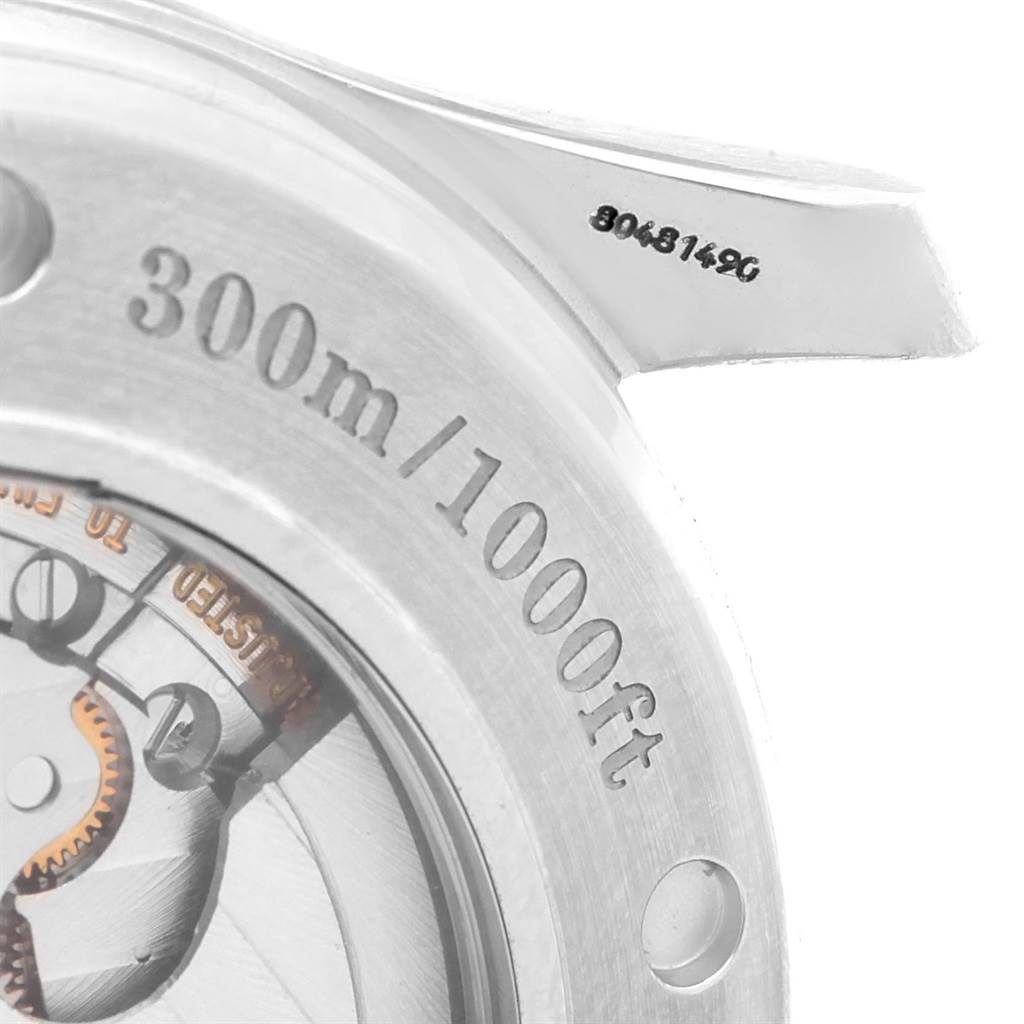 The image shows a close-up of the Omega Seamaster 2535.80.00 Men
s Stainless Steel Blue Dial 2535.80.00 Men
s Stainless Steel Blue Dial watch, highlighting the case back with depth rating and serial number.