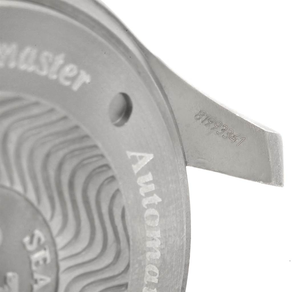 The image shows a close-up of the back casing of an Omega Seamaster 2269.52.00 Men's Titanium Black Dial 2269.52.00 Men's Titanium Black Dial watch, highlighting part of the serial number and engravings.