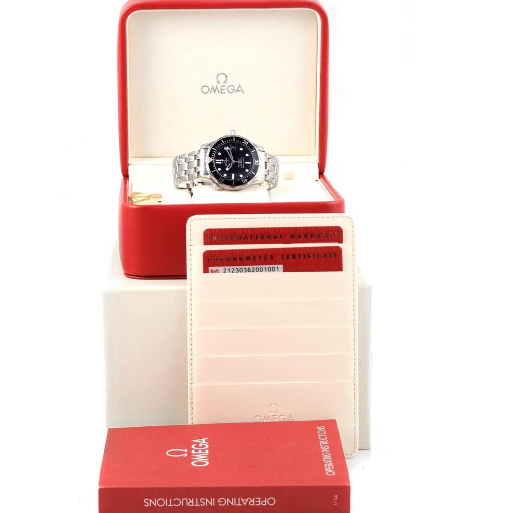 The image shows an Omega Seamaster 212.30.36.20.01.001 Men
s Stainless Steel Black Dial 212.30.36.20.01.001 Men
s Stainless Steel Black Dial watch in its box, with the chronometer certificate, warranty card, and operating instructions booklet displayed.