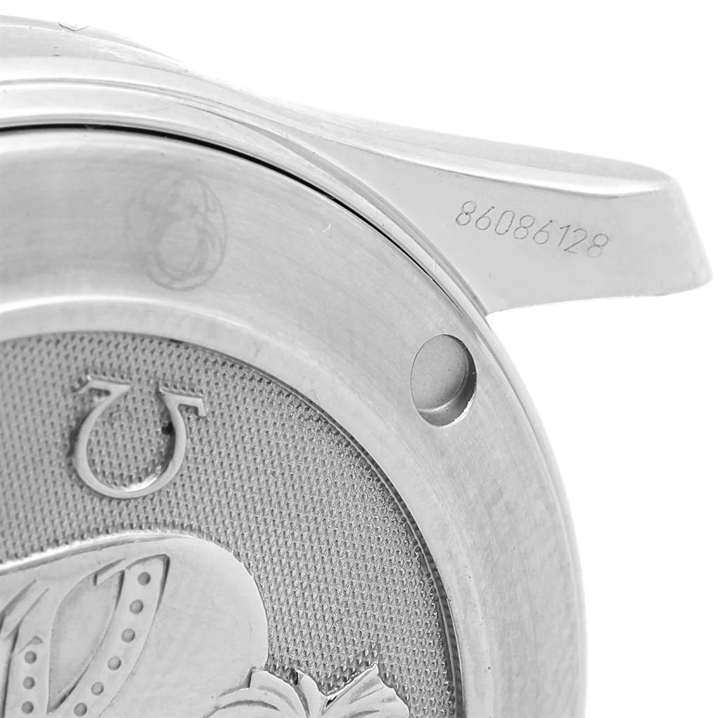 The image shows a close-up of the case back and one lug of the Omega Seamaster 212.30.36.20.01.001 Men
s Stainless Steel Black Dial 212.30.36.20.01.001 Men
s Stainless Steel Black Dial watch, including part of the engraved serial number.