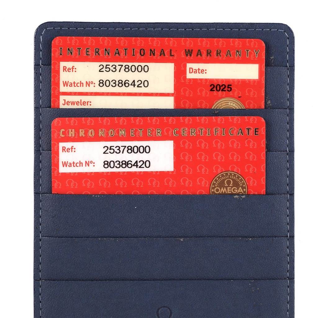 The image shows international warranty and chronometer certificate cards for an Omega Seamaster 2537.80.00 Men's Stainless Steel Blue Dial 2537.80.00 Men's Stainless Steel Blue Dial watch.