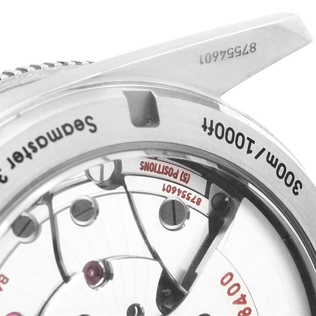 The image shows a close-up of the caseback and movement parts of the Omega Seamaster 233.90.41.21.03.001 Men's Titanium Blue Dial 233.90.41.21.03.001 Men's Titanium Blue Dial watch.