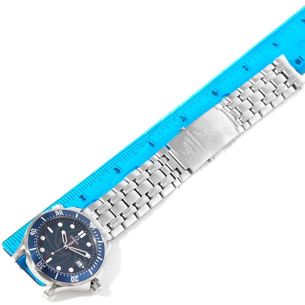 The Omega Seamaster 2226.80.00 Men's Stainless Steel Blue Dial 2226.80.00 Men's Stainless Steel Blue Dial watch is displayed from a top view, showing its face, bezel, and stainless steel bracelet next to a ruler.