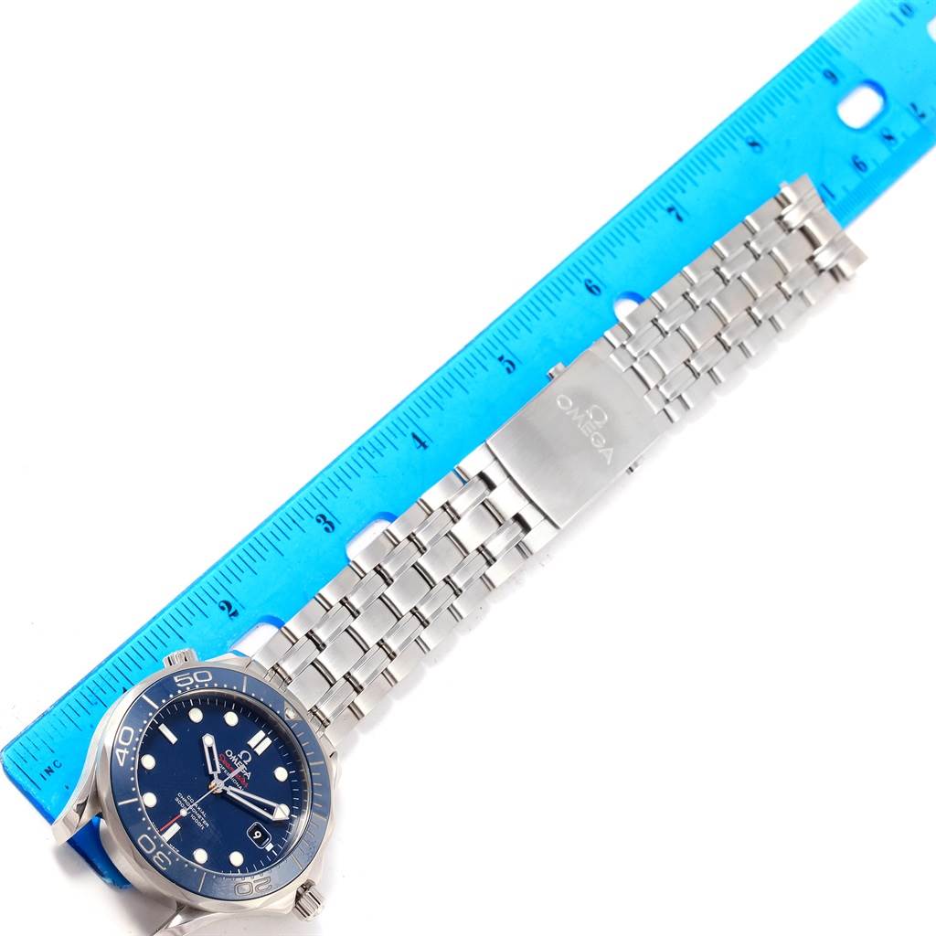 The Omega Seamaster 212.30.41.20.03.001 Men
s Stainless Steel Blue Dial 212.30.41.20.03.001 Men
s Stainless Steel Blue Dial watch is shown from a top-down angle, displaying its stainless steel bracelet, clasp, and blue dial alongside a ruler for scale.