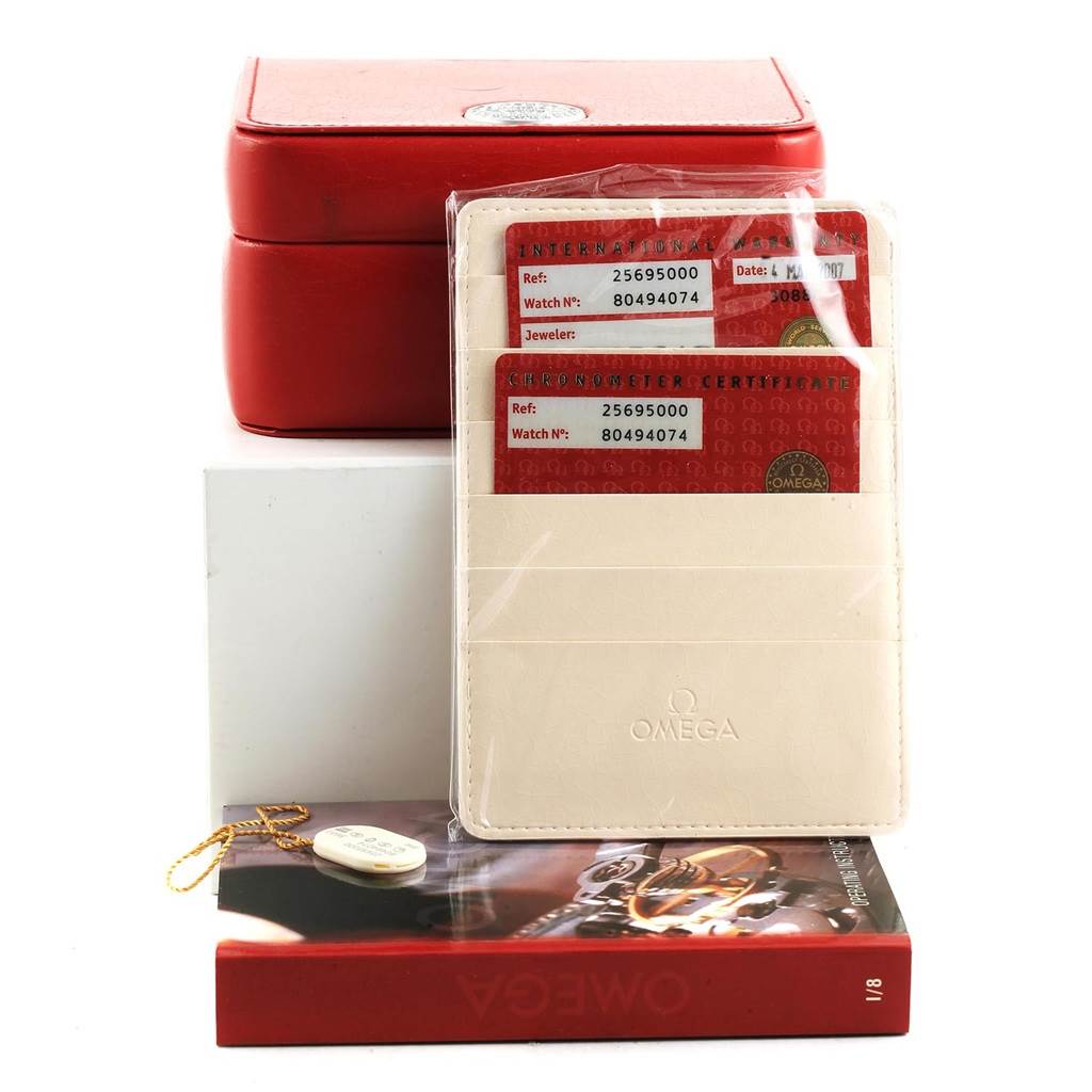 The image shows the box, warranty cards, and manual of the Omega Seamaster 2569.50.00 Men
s Stainless Steel Black Dial 2569.50.00 Men
s Stainless Steel Black Dial watch.