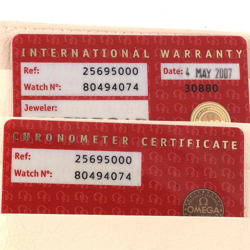 The image shows Omega Seamaster 2569.50.00 Men
s Stainless Steel Black Dial 2569.50.00 Men
s Stainless Steel Black Dial
s International Warranty and Chronometer Certificate cards.