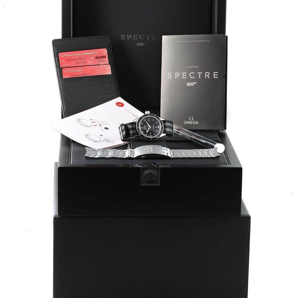 The image shows an Omega Seamaster 233.32.41.21.01.001 Men's Stainless Steel Black Dial 233.32.41.21.01.001 Men's Stainless Steel Black Dial watch, instruction manuals, warranty cards, and a metal bracelet, all from a front angle.