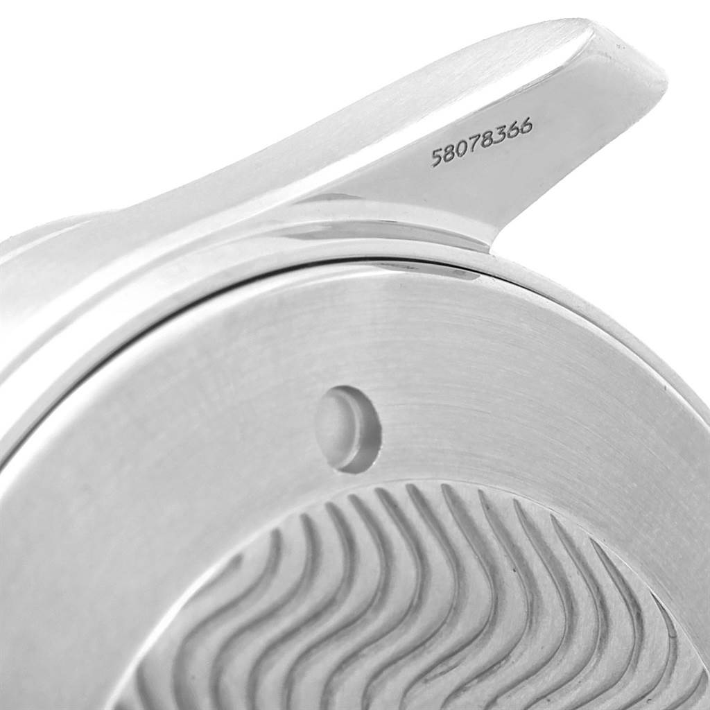 This image shows an angled close-up of the Omega Seamaster 2541.80.00 Men
s Stainless Steel Blue Dial 2541.80.00 Men
s Stainless Steel Blue Dial watch case and lugs with visible wave patterns and markings.