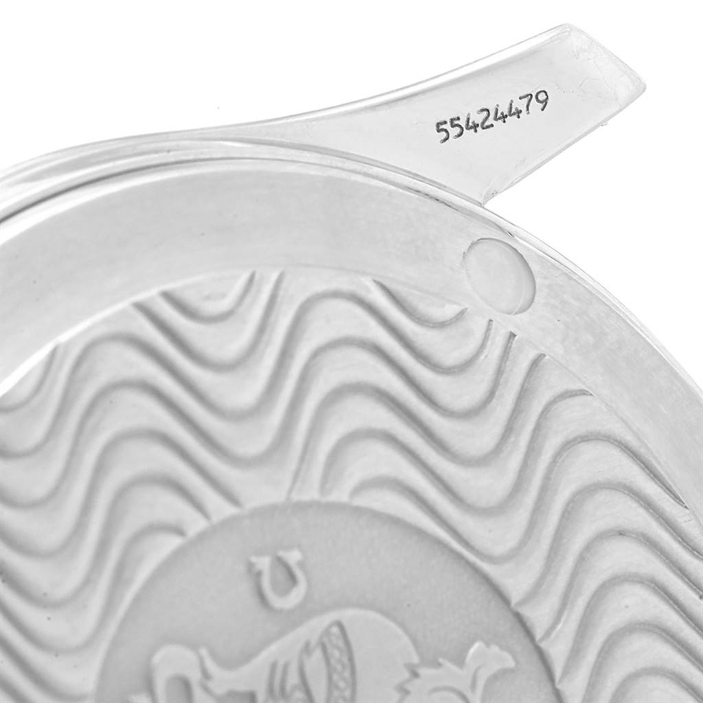 This close-up image shows the case back of the Omega Seamaster 2561.80.00 Men
s Stainless Steel Blue Dial 2561.80.00 Men
s Stainless Steel Blue Dial watch, featuring its wavy design and serial number.