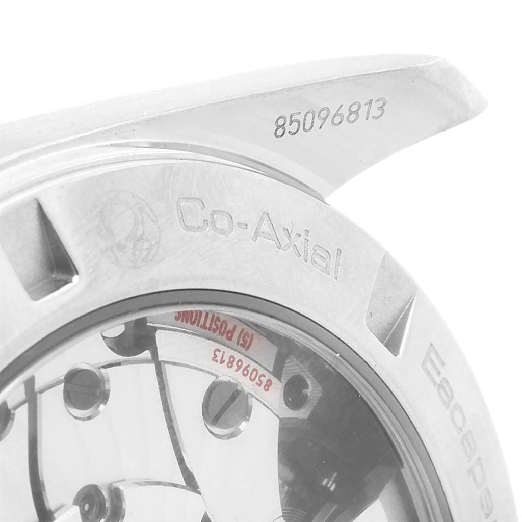 The image shows a close-up of the rear casing and part of the movement of the Omega Aqua Terra 231.10.42.21.02.001 Men
s Stainless Steel Silver Dial 231.10.42.21.02.001 Men
s Stainless Steel Silver Dial watch.