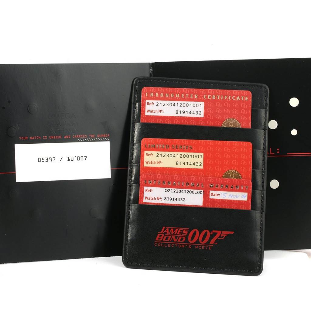 The image shows warranty cards and a certificate for an Omega Seamaster 212.30.41.20.01.001 Men
s Stainless Steel Black Dial 212.30.41.20.01.001 Men
s Stainless Steel Black Dial James Bond 007 limited series watch.