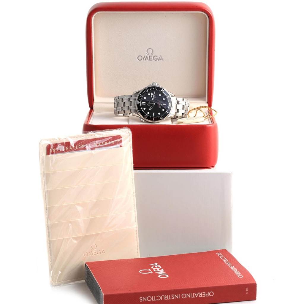 The image shows an Omega Seamaster 212.30.41.61.01.001 Men
s Stainless Steel Black Dial 212.30.41.61.01.001 Men
s Stainless Steel Black Dial watch placed in its red case with accompanying warranty cards and an instruction manual.