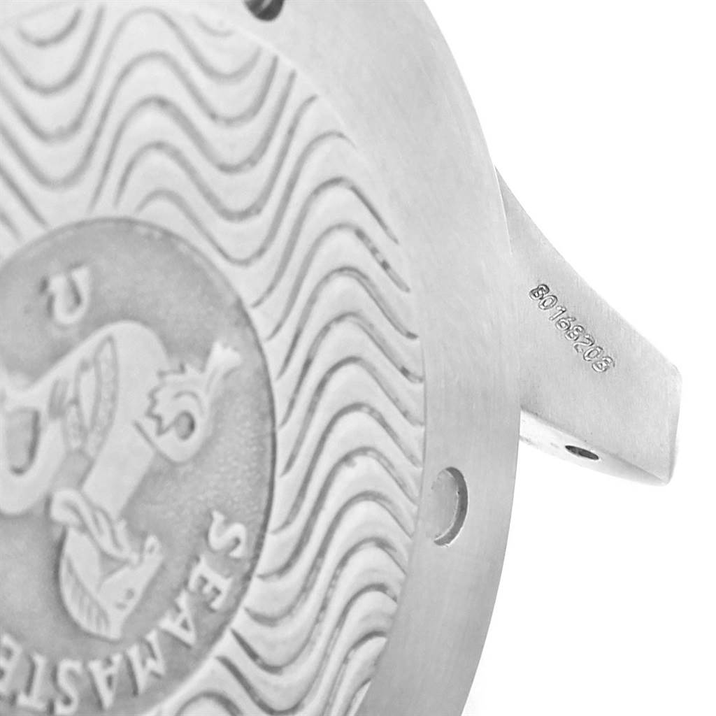 The image shows a close-up of the Omega Seamaster 2538.20.00 Men
s Stainless Steel White Dial 2538.20.00 Men
s Stainless Steel White Dial
s case back, featuring engravings and part of the lug.