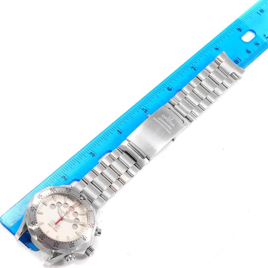 The image shows an Omega Seamaster 2595.30.00 Men
s Stainless Steel Silver Dial 2595.30.00 Men
s Stainless Steel Silver Dial watch laid flat, featuring the face, bezel, dials, and metal bracelet against a ruler.