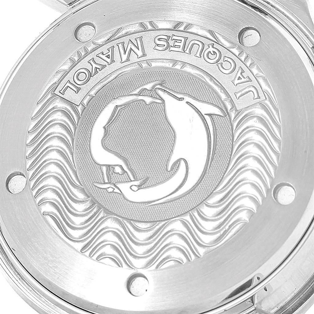 The image shows the detailed case back of an Omega Seamaster 2595.30.00 Men
s Stainless Steel Silver Dial 2595.30.00 Men
s Stainless Steel Silver Dial watch, featuring engravings and a raised dolphin design.