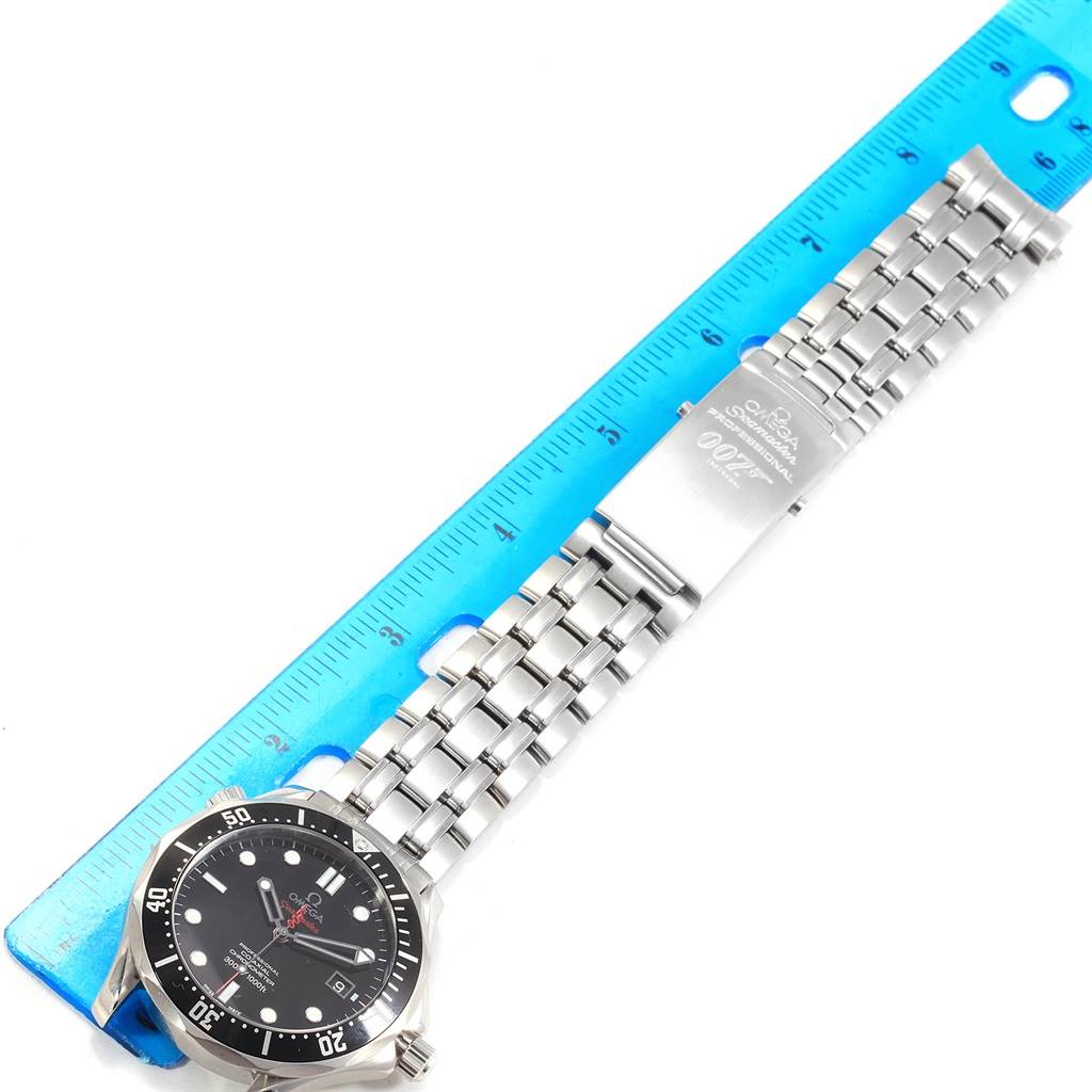 The image shows the face and bracelet of an Omega Seamaster 212.30.41.20.01.001 Men
s Stainless Steel Black Dial 212.30.41.20.01.001 Men
s Stainless Steel Black Dial watch, laid flat next to a blue ruler for size reference.